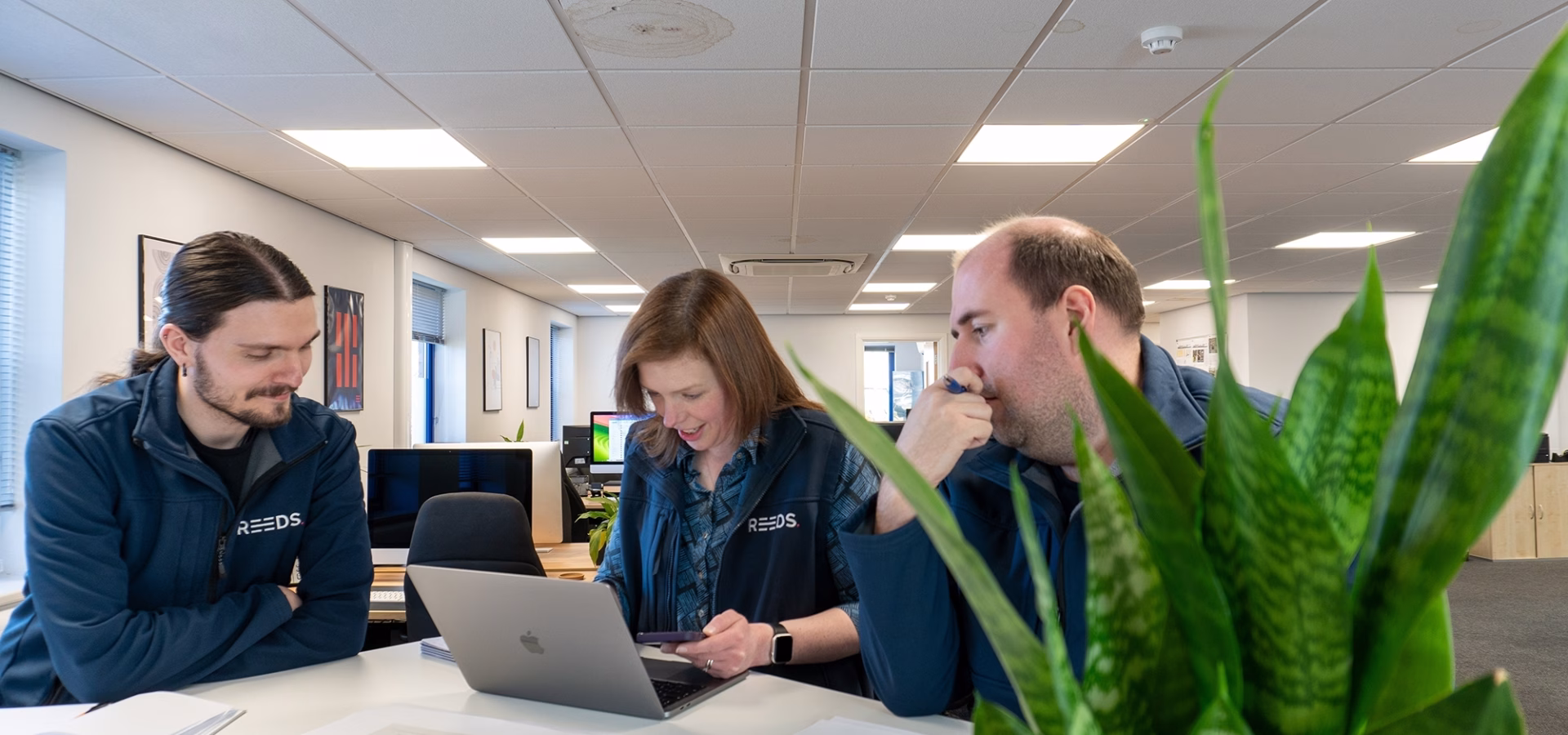 Luke, Judith, and Chris reviewing work