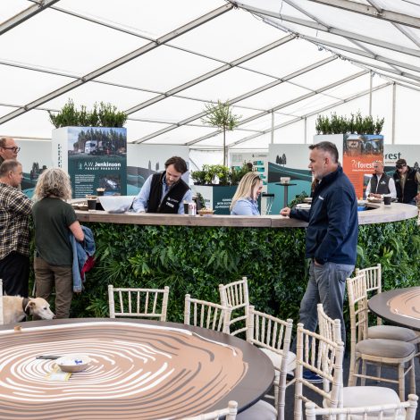 People enjoying the exhibition space, featuring the tailored table coverings