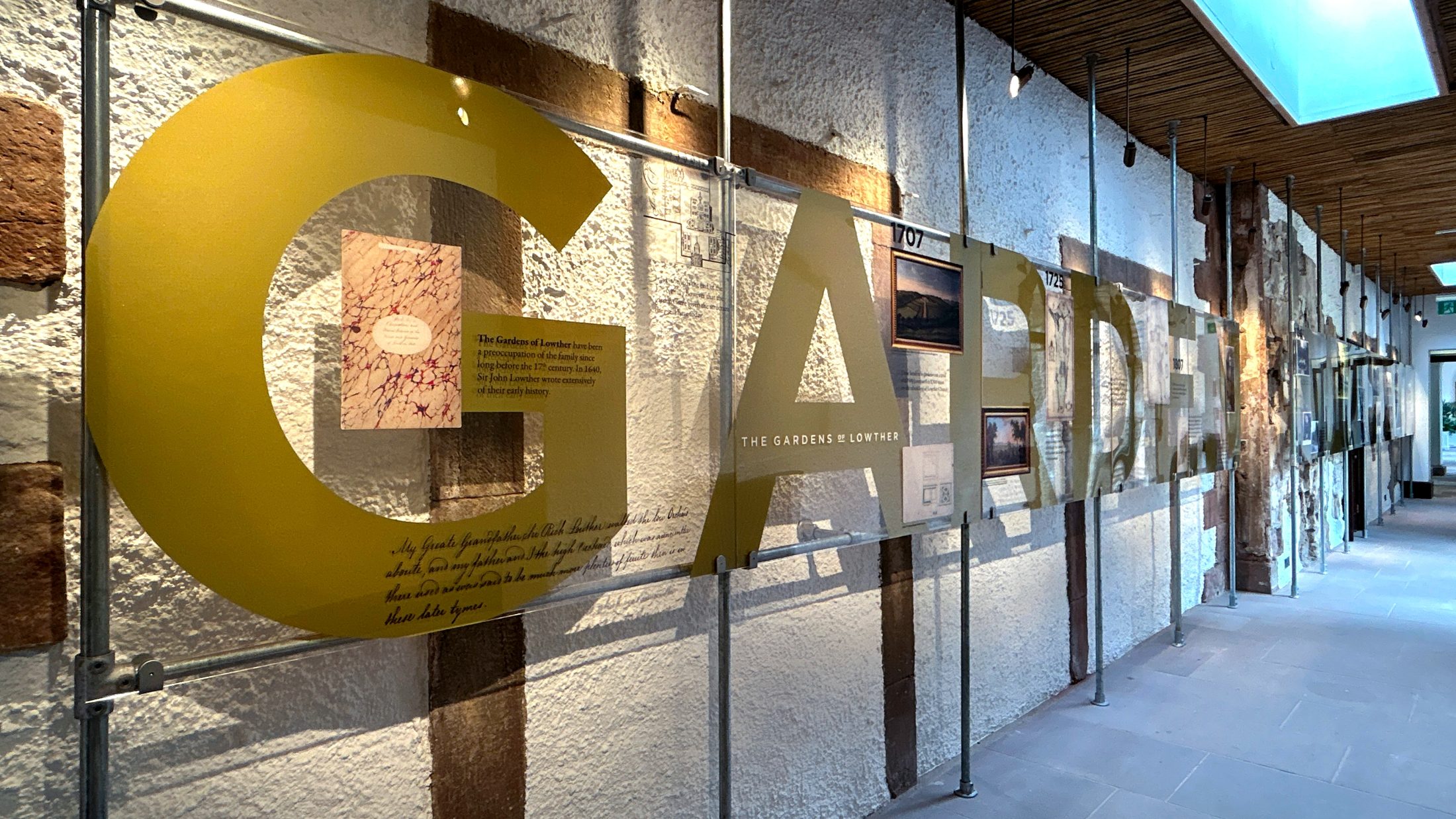 The Story of Lowther exhibition, clear acrylic exhibition signage for the Gardens of Lowther section