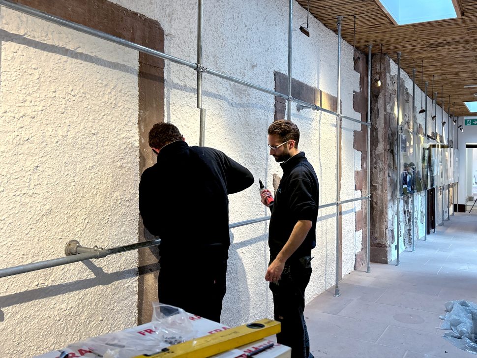 Andy and Marc from Reeds signs team fitting the clear acrylic exhibition signage for the Gardens of Lowther section