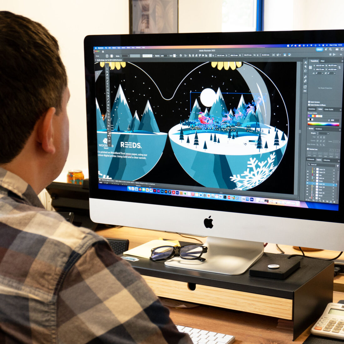 Christmas card design, image of a monitor with the card being designed