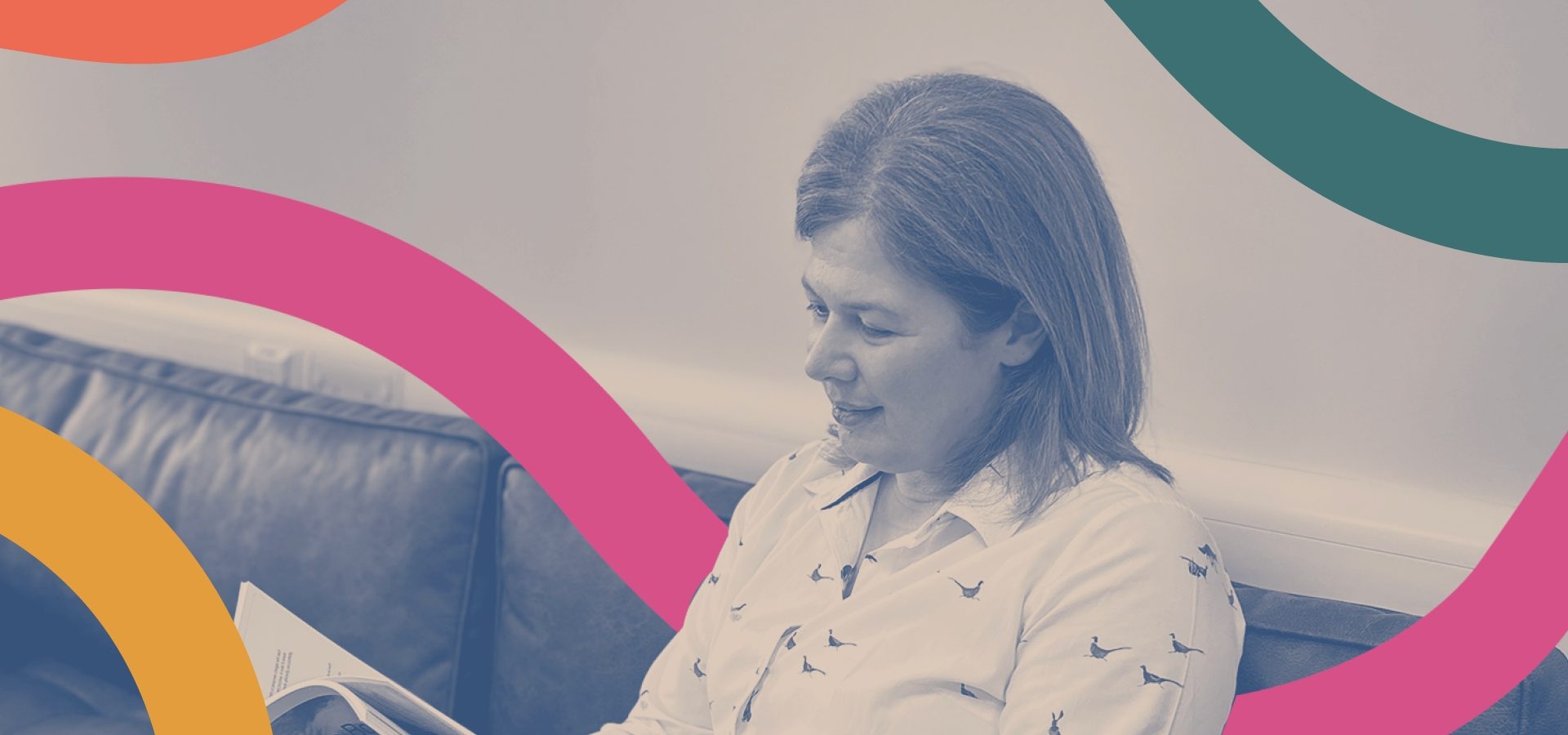 Becca Davidson, reading a branding book she designed at Reeds.