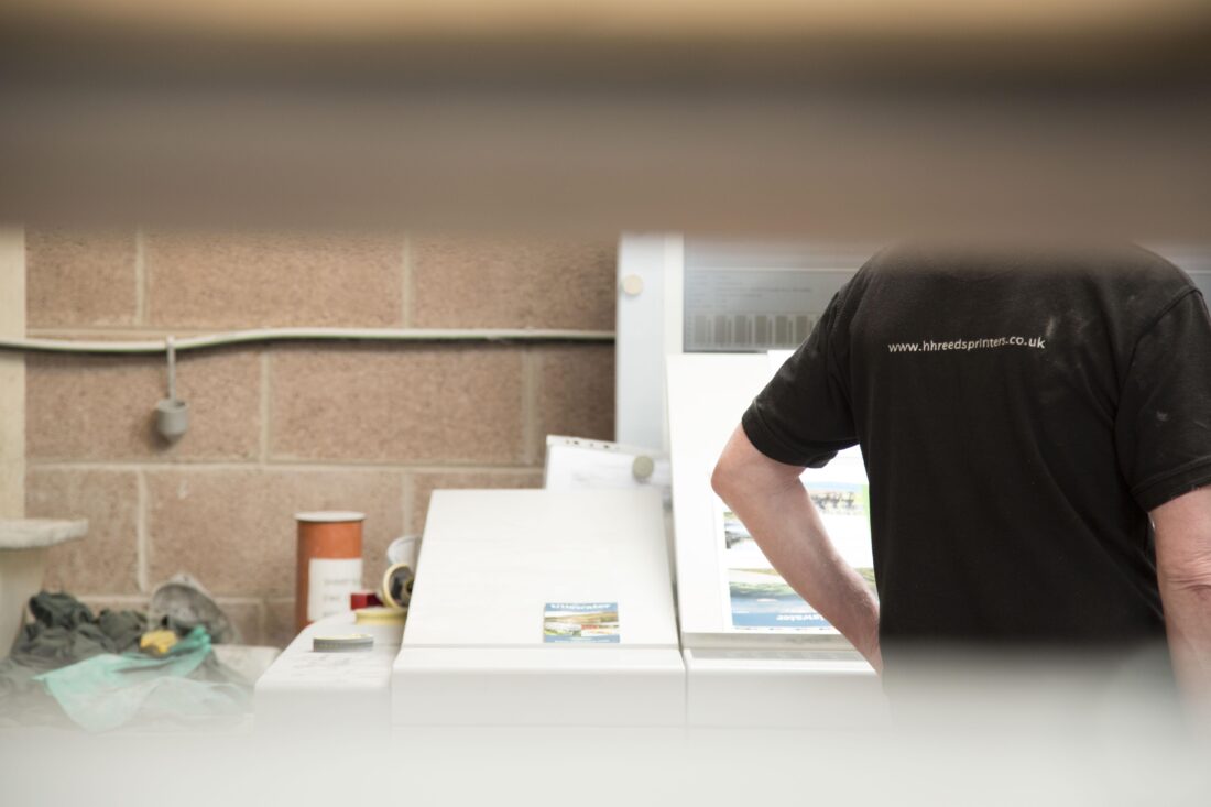 Team photo  blurred image of back of a t-shirt saying reeds