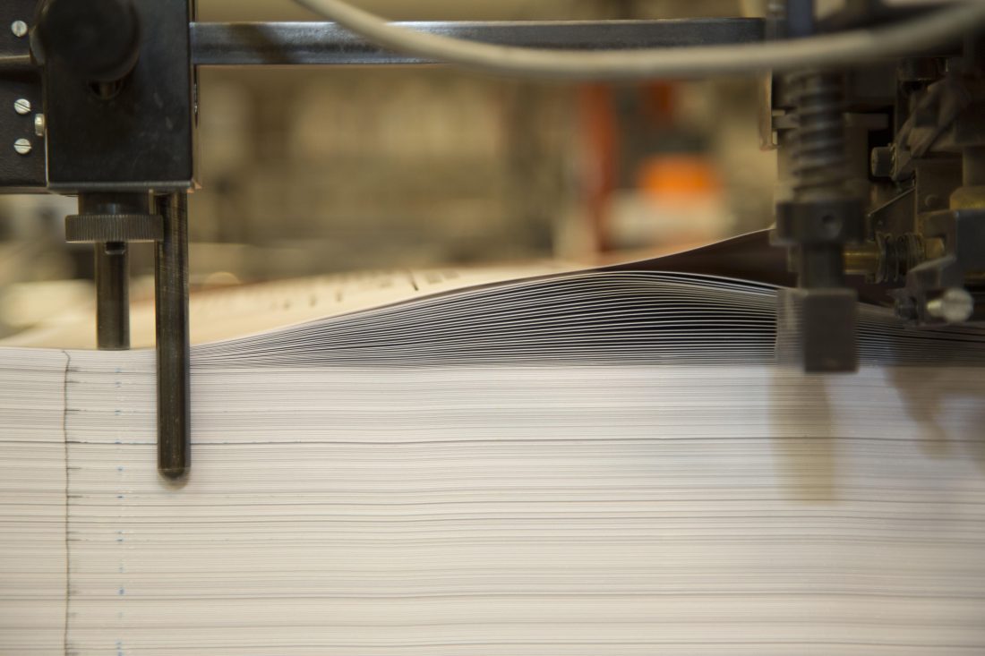 Paper going through the litho printer