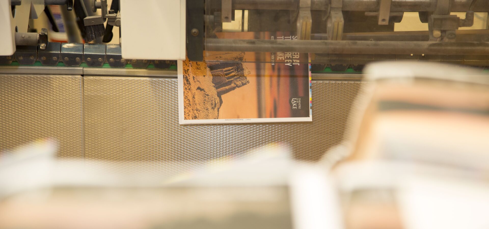 brochure being stitched