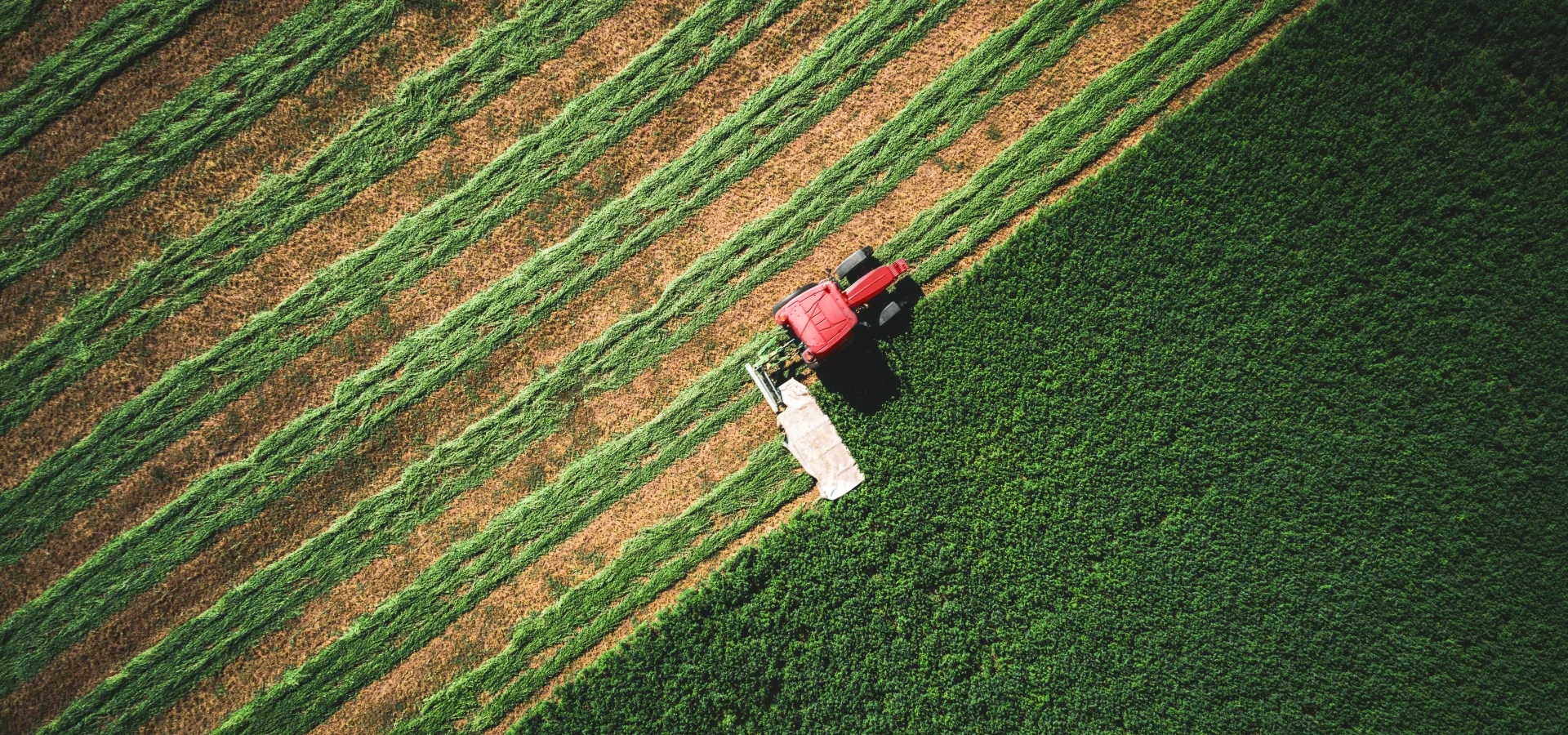 Image of a tractor plowing a field from above
